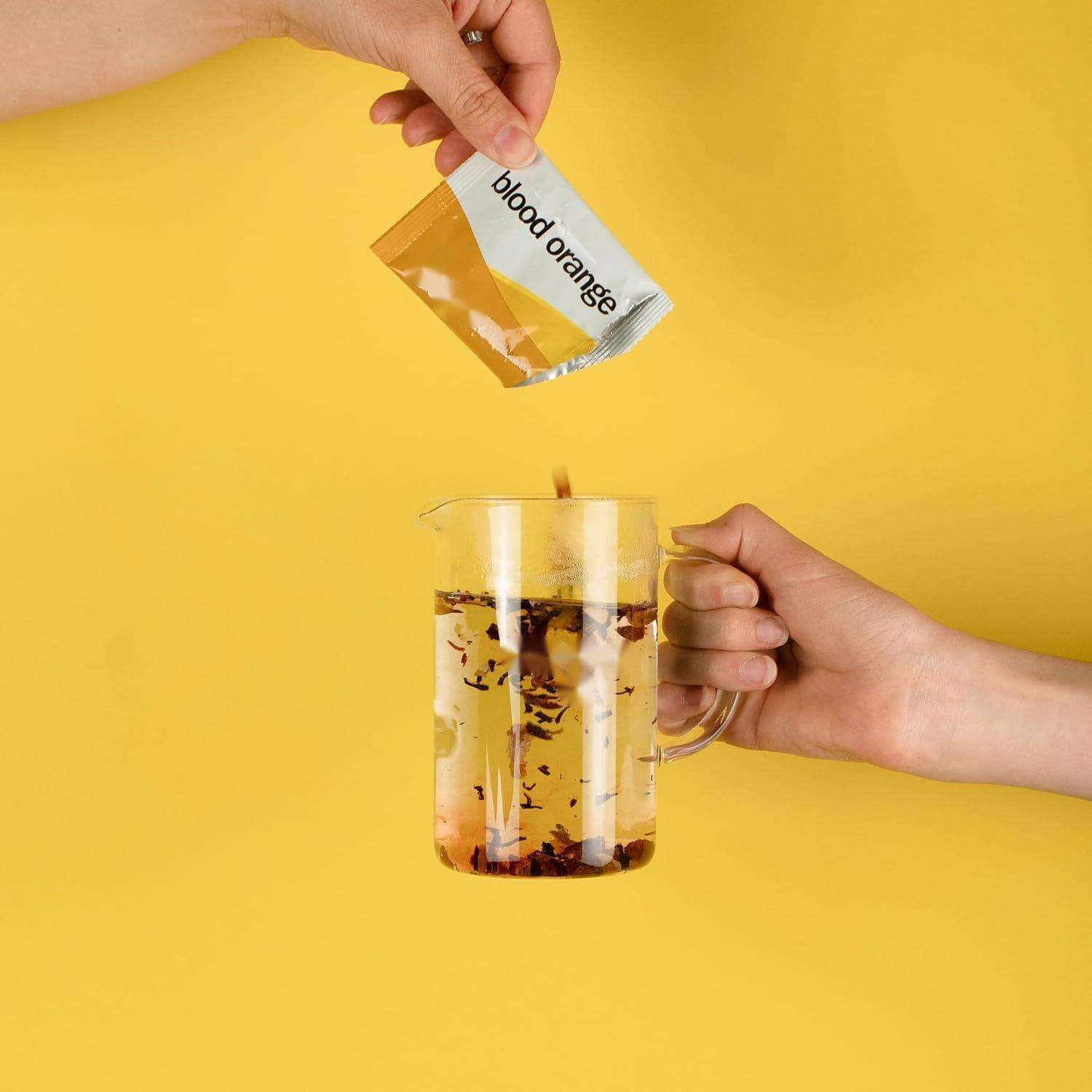 Assorted tea bags, including Black and White Peach Irish Breakfast Tea and Green Tea